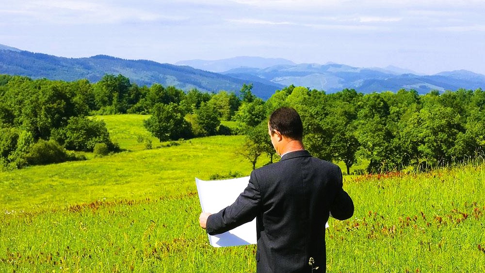 Man looking at building plan